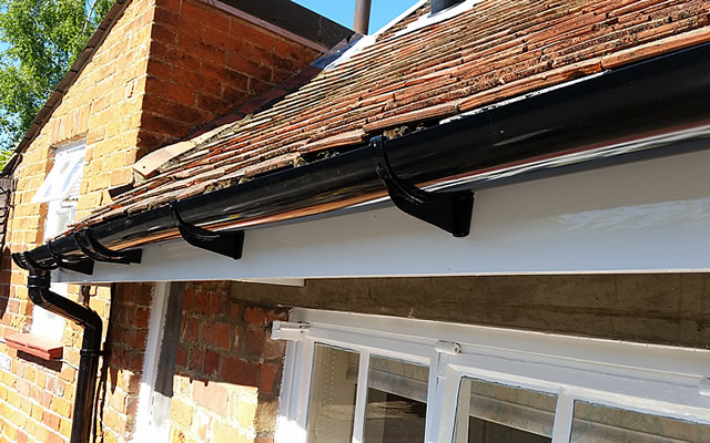 Guttering repairs and replacement of fascia board on listed building