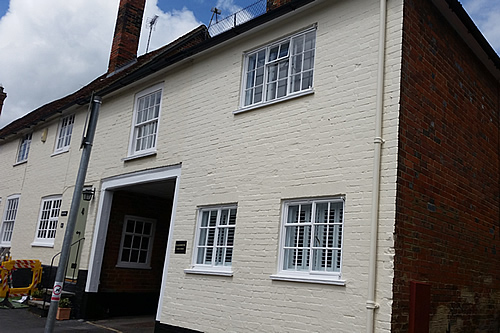Exterior walls and refurbished windows and painted walls in exterior masonry paint finish - work in progress