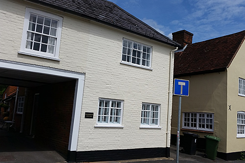 Exterior walls and refurbished windows and painted walls in exterior masonry paint finish- works complete