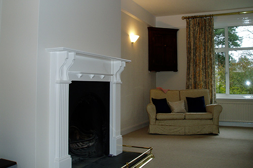 Lounge and fireplace decorated in designer paints