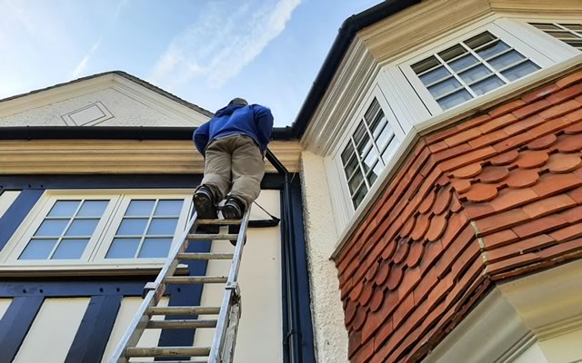 Checking and cleaning out guttering and downpipes out