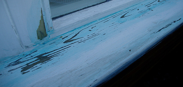 Window sill scraped off, rubbed down and primed