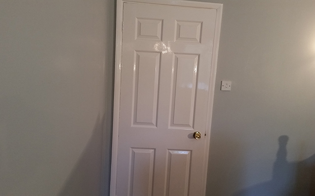 Six panel doors hung and painted in a gloss finish