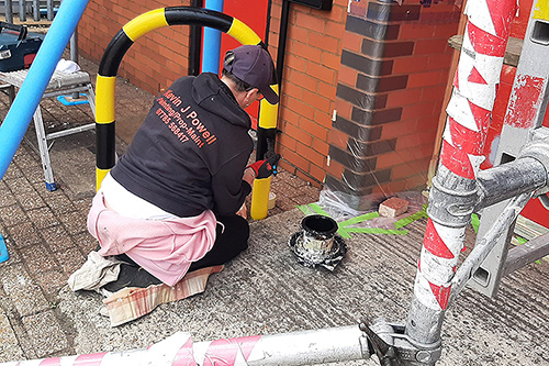 Warning Bars Black and yellow , in progress. using specialist paint