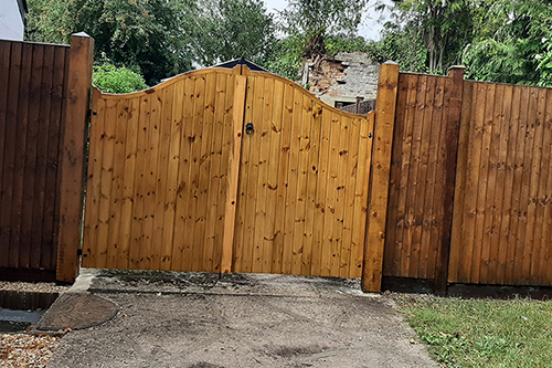  private Cottage, bespoke Driveway Gates, and Fencing, and gate posts, designed and fitted , and finished in specialist paint.