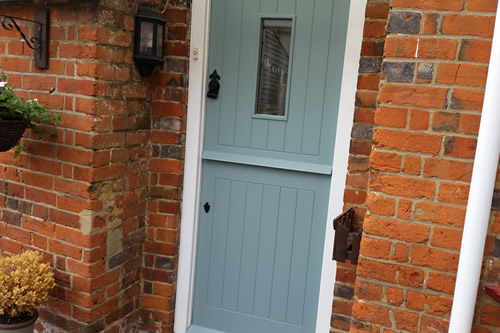 Finished stable door painted in designer paint on listed building