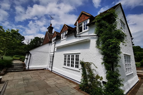 Property in Farnham, repairs and exterior decoration, white Dulux Trade, Wethersfield Masonry paint Finished