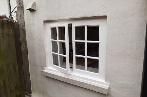 Window repairs, refurbishment and painted in specialists paint, to a Grade 2 listed property