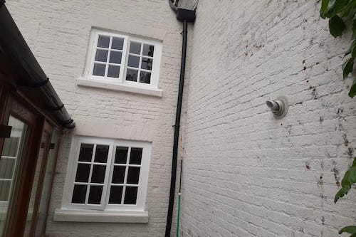 Window repairs, refurbishment and painted in specialists paint, to a Grade 2 listed property