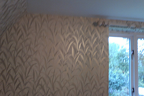 Designer wallpaper in a bedroom in Yateley