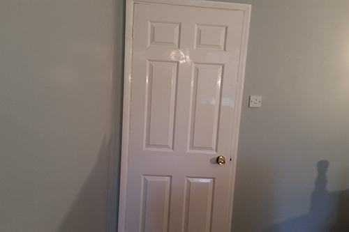 Six panel doors hung and painted in a gloss finish