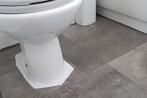 Finished Bathroom floor, with vinyl plank flooring